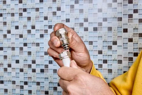 Compression coupling with threaded nut is positioned near end of multilayer.. Stock Photos