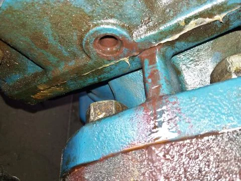 Compression Head Housing Viewed From Below Reveals Wear and Potential Leaka.. Stock Photos