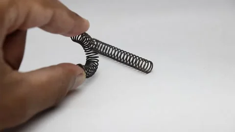 Compression spring bent and hitting a other resting spring Stock Footage 221347915