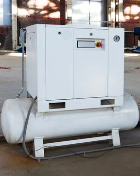 Compressor with motor in a modern workshop Stock Photos