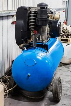Compressor with motor in modern workshop Stock Photos