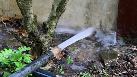Compressor pump water hitting a wall Stock Footage 329012720