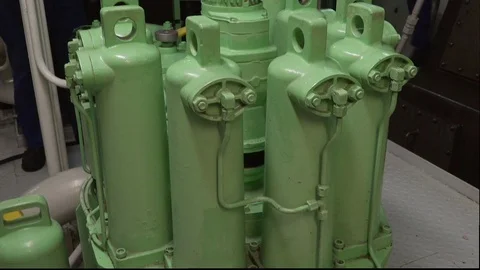 Compressor stands against working mechanic crew close view Stock Footage 121119451