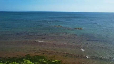 Compton Beach, Isle of Wight, UK 2023 - Flying low over hill and along the beach Stock Footage 243191403