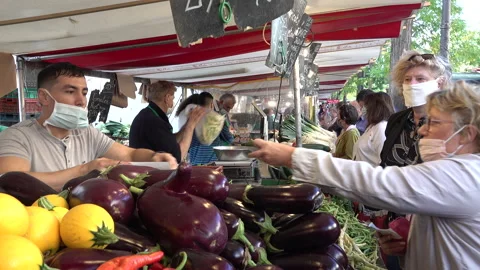Compulsory face masks (Covid-19 regulation) at food market in Paris France Stock Footage 139688773