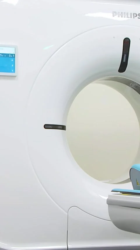 Computed axial tomography (CAT). CT scanner.  - Vertical video. Stock Footage 318836310