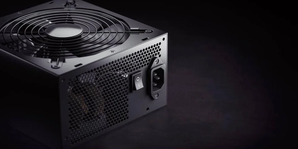 Computer AC power supply unit on black background. Computer AC power suppl... Stock-Fotos