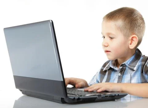 Computer addiction child with laptop notebook Stock Photos