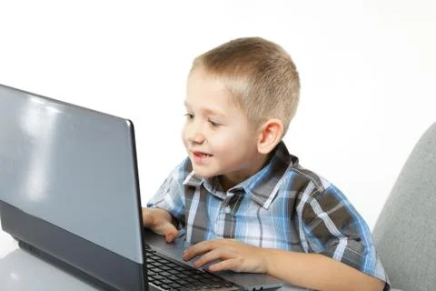 Computer addiction child with laptop notebook Stock Photos