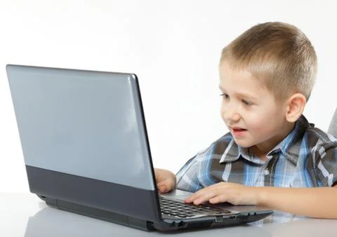 Computer addiction child with laptop notebook Stock Photos