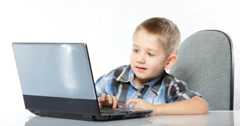 Computer addiction child with laptop notebook Stock Photos