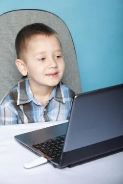 Computer addiction child with laptop notebook Stock Photos