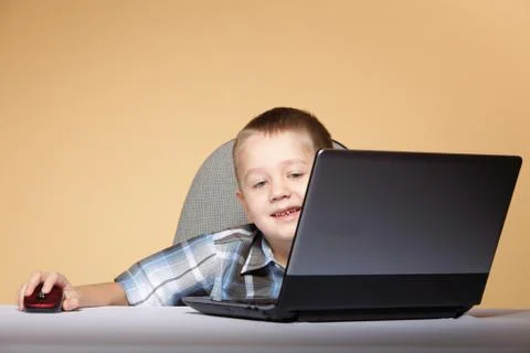 Computer addiction child with laptop notebook Stock Photos
