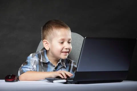 Computer addiction child with laptop notebook 스톡 사진