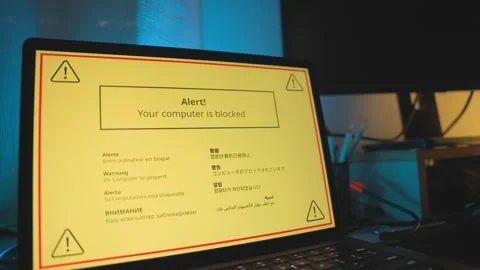 Computer alert appear in yellow on screen warning of hacking attack or virus Stockbeeldmateriaal 328543408