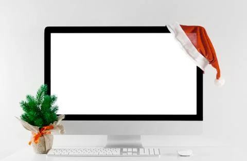 Computer all in one with isolated white screen in Christmas time. Stock Photos