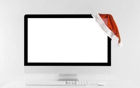 Computer all in one with isolated white screen in Christmas time. Stock Photos