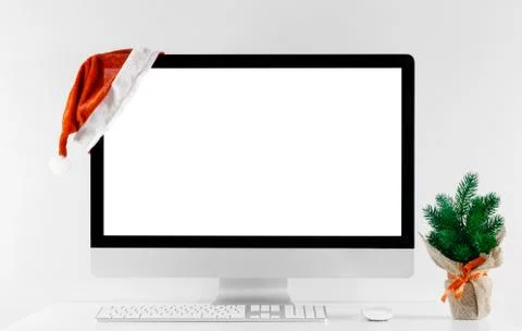 Computer all in one with isolated white screen in Christmas time. Stock Photos