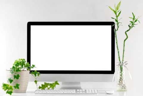 Computer all in one in office table with isolated white screen Stock Photos