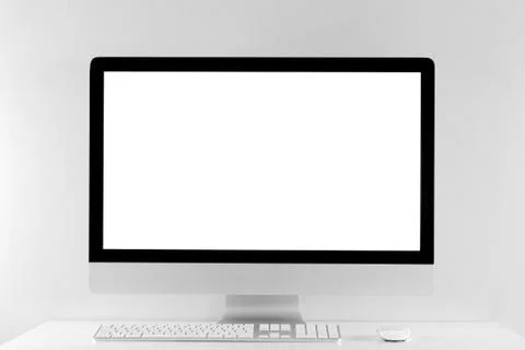Computer all in one in office table with isolated white screen Stock Photos
