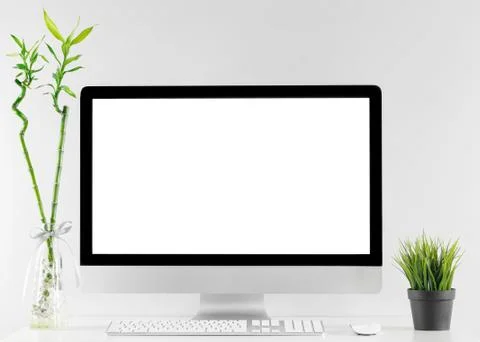 Computer all in one in office table with isolated white screen Stock Photos