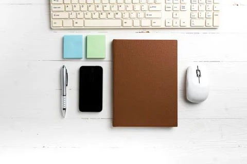Computer and brown notebook with office supplies Stock Photos