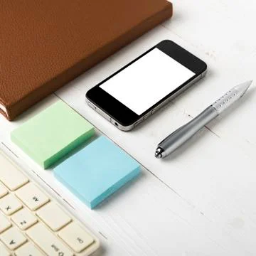 Computer and brown notebook with office supplies Stock Photos