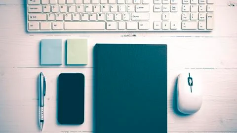 Computer and brown notebook with office supplies vintage style Stock Photos