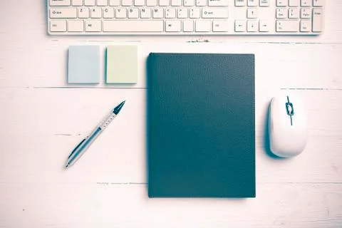 Computer and brown notebook with office supplies vintage style Stock Photos