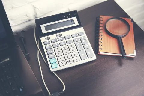 Computer and calculator  on table Stock Photos