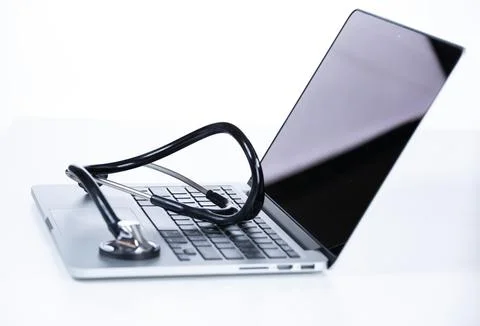 Computer and data analysis concept. Stethoscope over a laptop computer Foto stock
