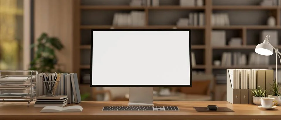 A computer and decorative items placed on a wooden desk in a contemporary c.. 스톡 일러스트