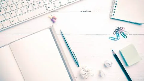 Computer and notebook with office supplies vintage style Stock Photos