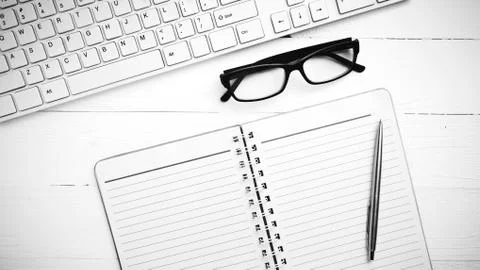 Computer and notepad black and white tone color style Stock Photos