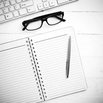Computer and notepad black and white tone color style Stock Photos