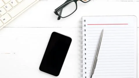 Computer and notepad with smart phone Stock Photos