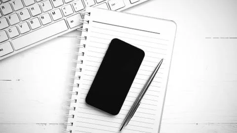 Computer and notepad with smart phone black and white tone color style Stock Photos