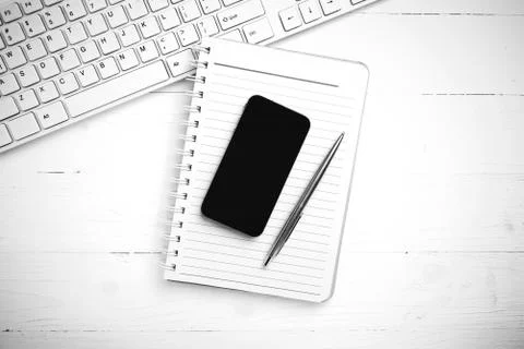 Computer and notepad with smart phone black and white tone color style Stock Photos