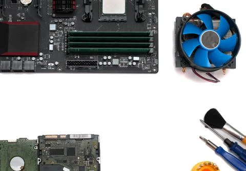 Computer assembly details and tools on a white background Stock Photos