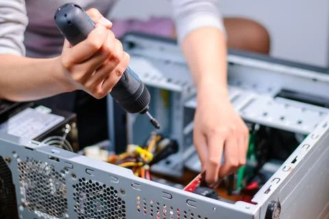 Computer assembly process technician working a workshop technology indoor c.. Stock Photos