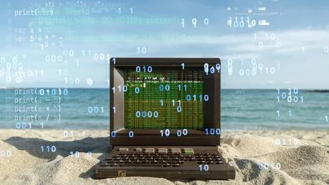 Computer on a beach with data and code on screen Foto stock