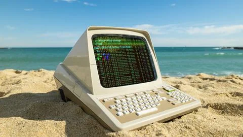 Computer on a beach with data and code on screen Stock Photos