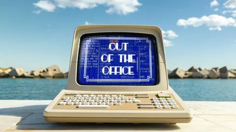Computer on a beach with words out of office on screen 库存照片