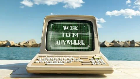 Computer on a beach with words work from anywhere on screen 写真素材