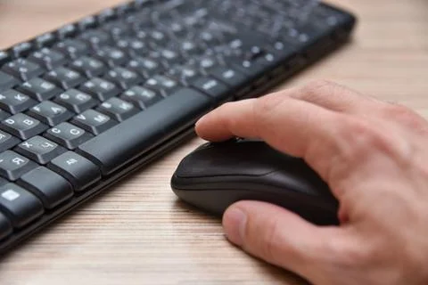 Computer black keyboard and mouse on the table Stock Photos