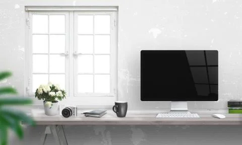    Computer with blank screen on office desk. Window and white wall in backgrou Stock Photos