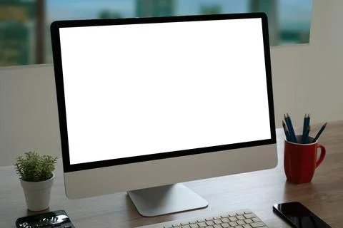 Computer with blank screen on table. Workspace background new project on la.. Stock Photos