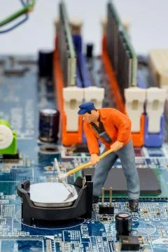 Computer board and construction workers Stock Photos