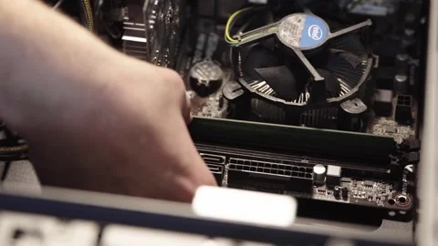 Computer builder swapping a computer part Video stock 248112909