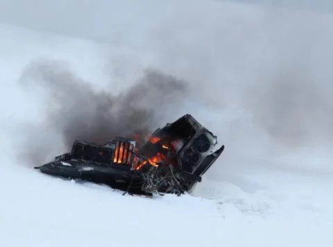Computer burning in the snow Stock Photos